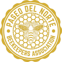 First-party Paseo del Norte Beekeepers Association round gold seal with a honey bee on honeycomb inside the association name.