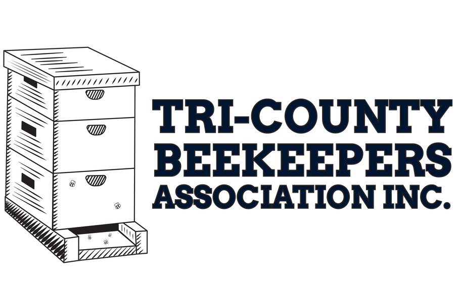 Tri-County Beekeepers Association circular seal with a honey bee, honeycomb, and the letters TCBA.